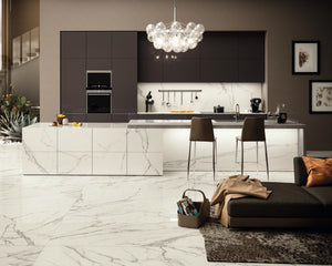 The custom kitchen island, backsplash and floor in a gentle white with grey veining creates a classic, high end finish in this residential kitchen. Distributor is in western Canada. 