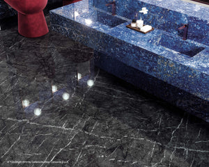 The deep tones with the light veining in the polished floor form a dramatic effect with high quality porcelain tiles. It is a low maintenance option in many areas, including washrooms. See the full slab in the showroom in Edmonton, Alberta. 