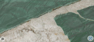 Green and beige stone effect porcelain surface with  biophilic design in stock.