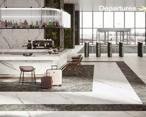 The polished floor in the departure zone is created with large format porcelain tile in Statuario Supremo, accented by Grigio Intensio. 