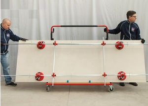 Montolit Goal Evo Transport Cart with two men carrying a large format tile with four suction cups applied to the tile.