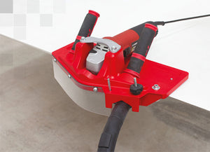 Toprofile , tile beveling machine, by Montolit, red in color and has two handles with a vacuum attachment.